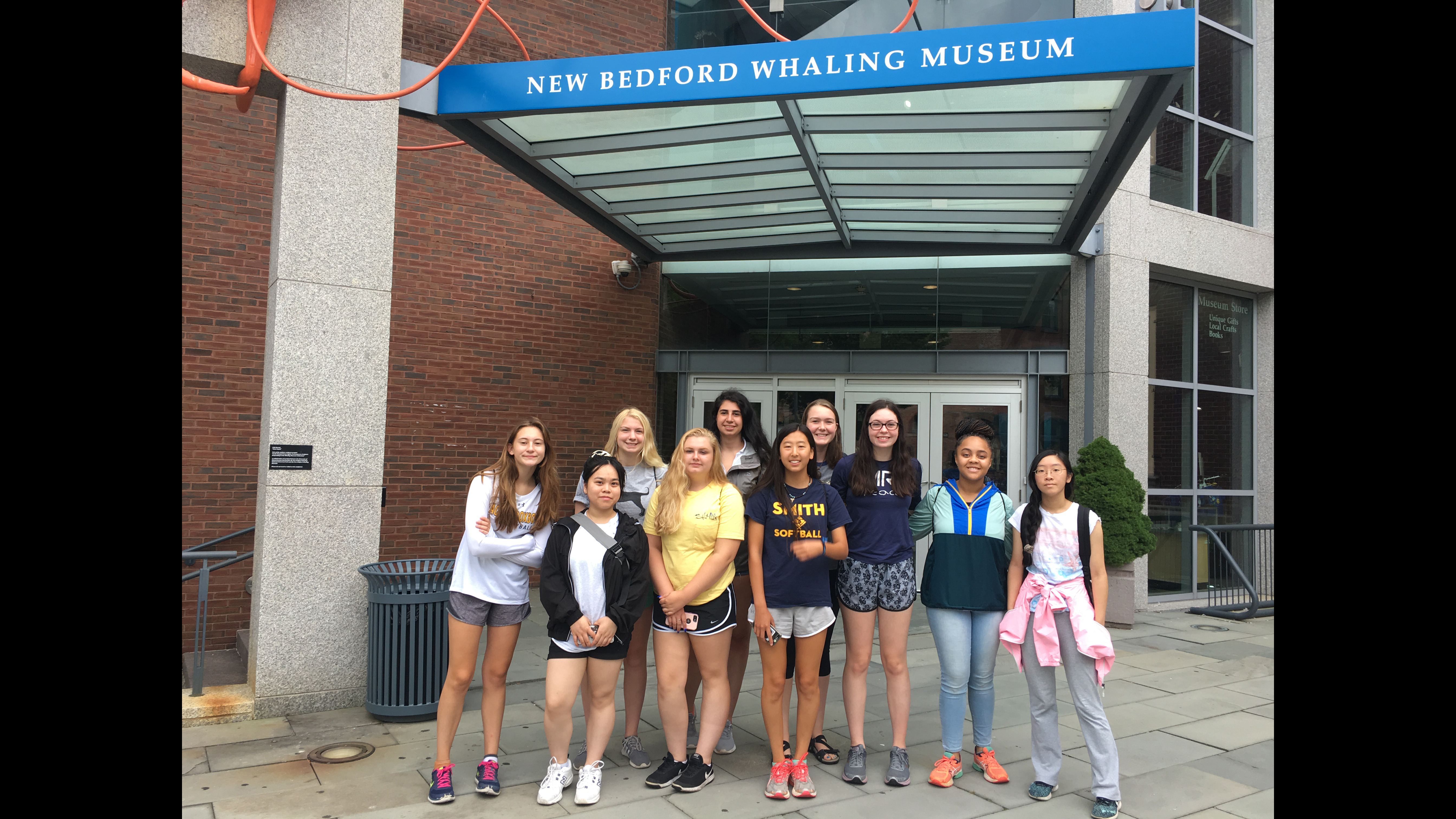 The 10 Girls in Science fellows during their field trip to the New Bedford Whaling Museum.