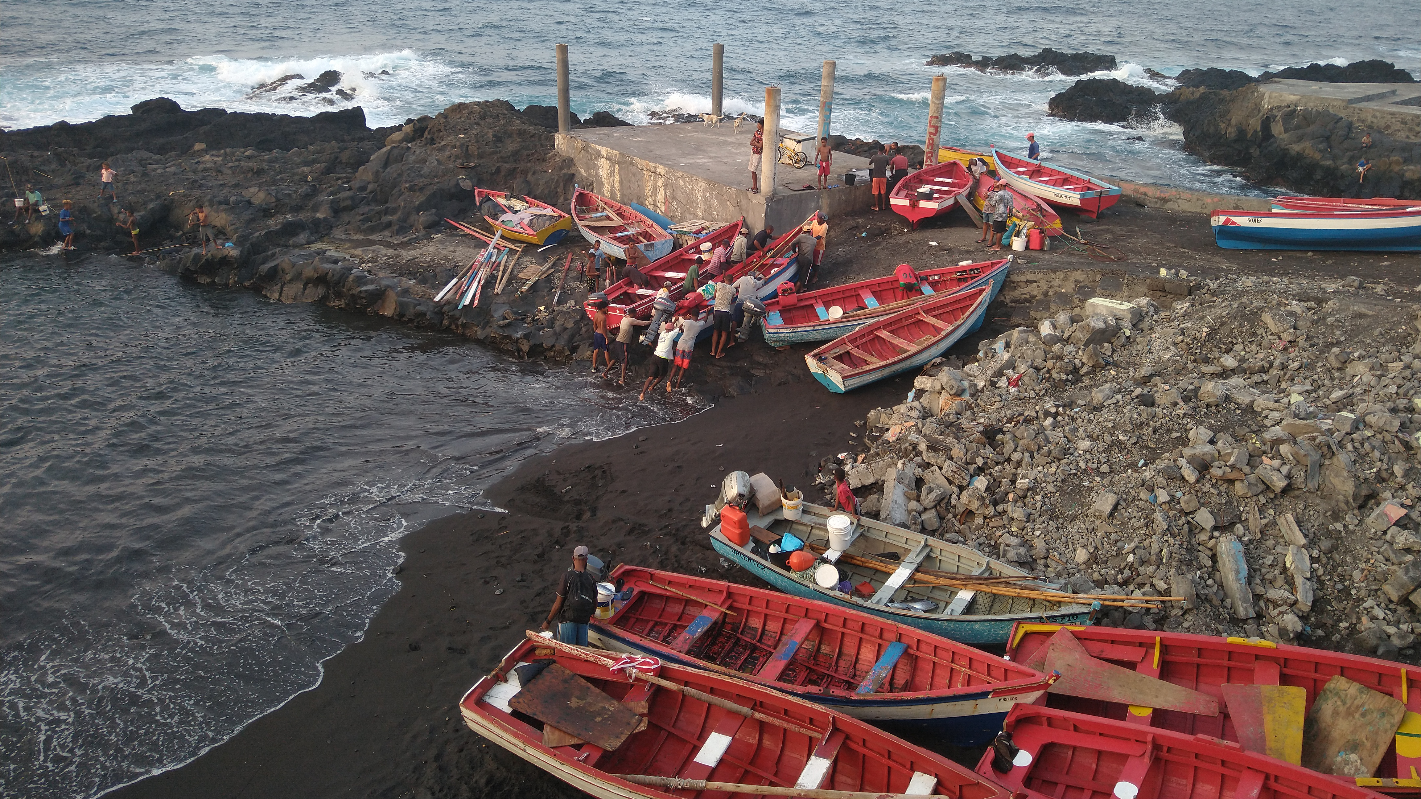 Small red fishing boats in a Cape Verdean harbor