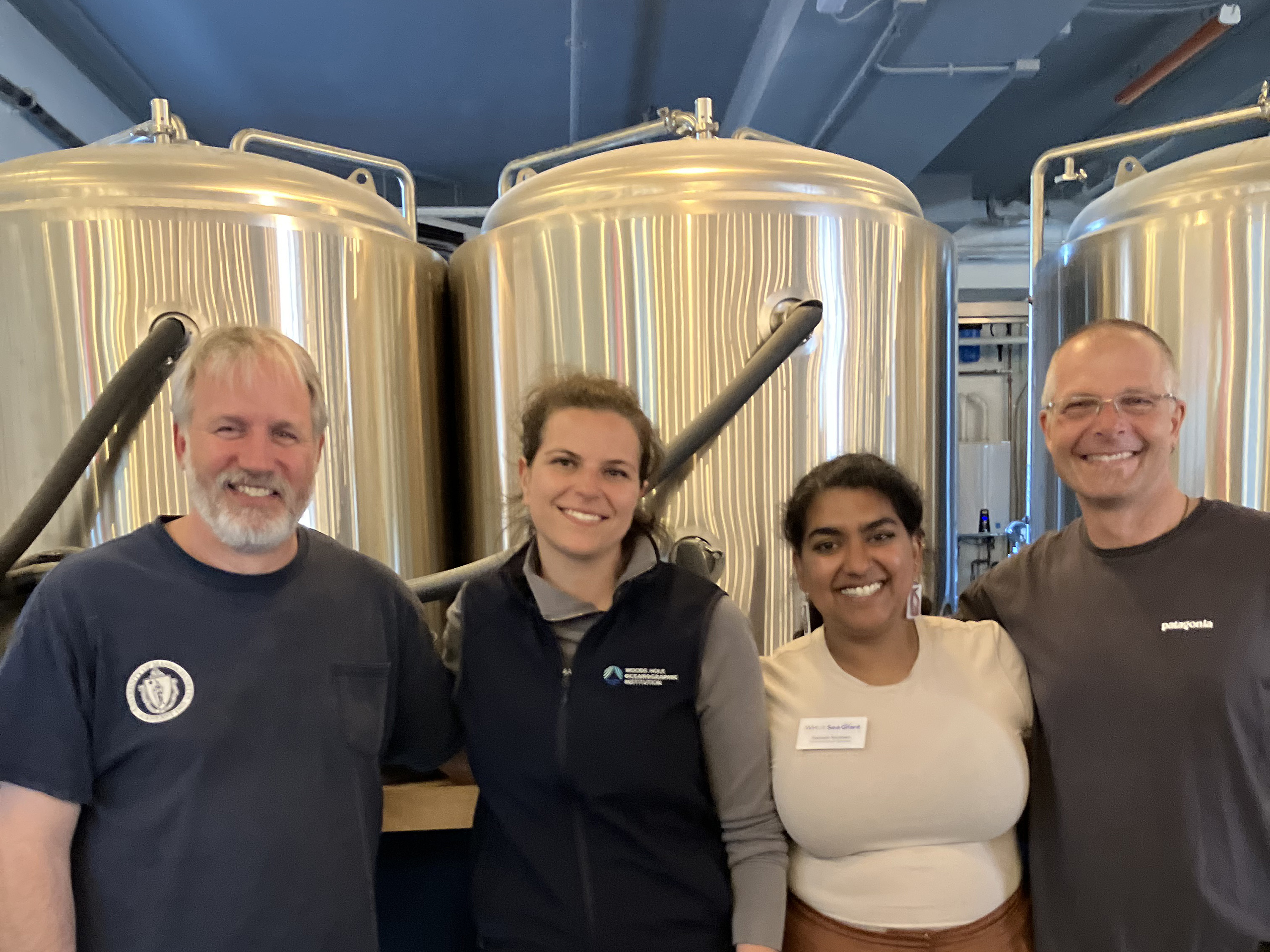 Event organizers, Jennie Rheuban and Poonam Narotam pose with UMass Amherst scientists Adrian Jordaan and Andy Danylchuk.