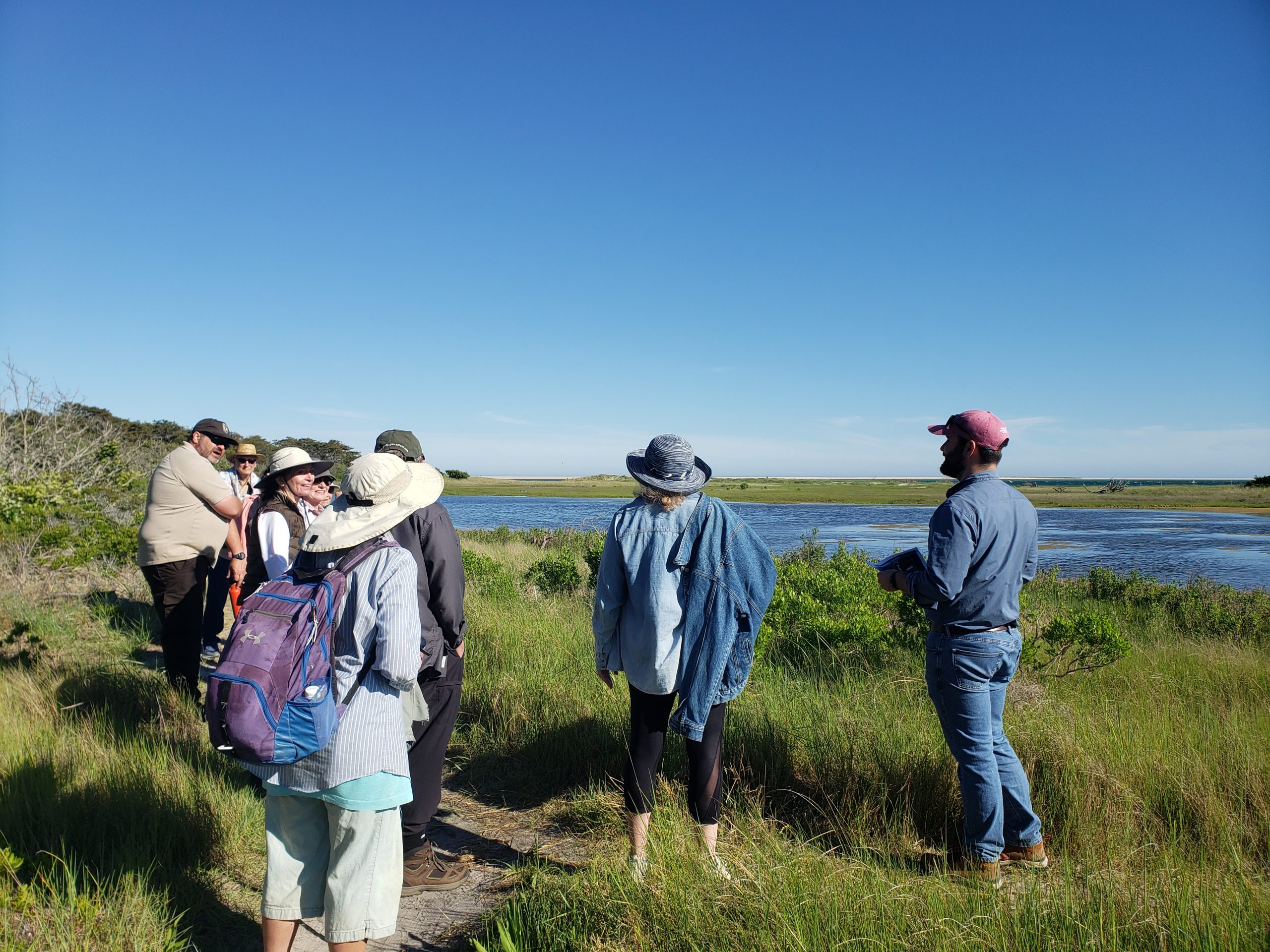 Coastal Processes Specialist Bryan McCormack, right, leads a group through the Monomoy National Wildlife Refuge in Chatham.