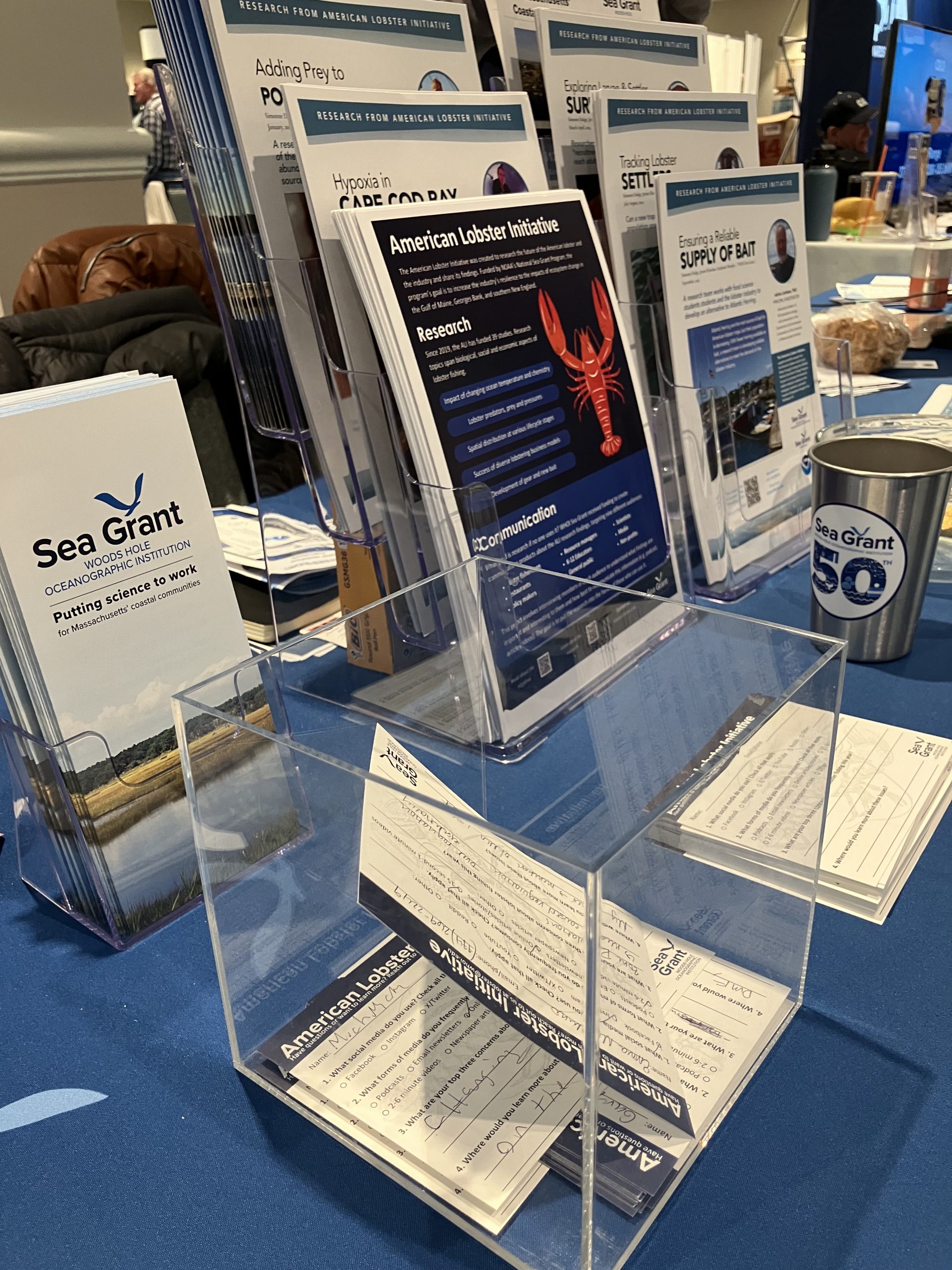ALI-related information displayed at the Mass. Lobstermen's Association meeting in Jan. 2025. Kiran's collected survey cards are in the foreground. 