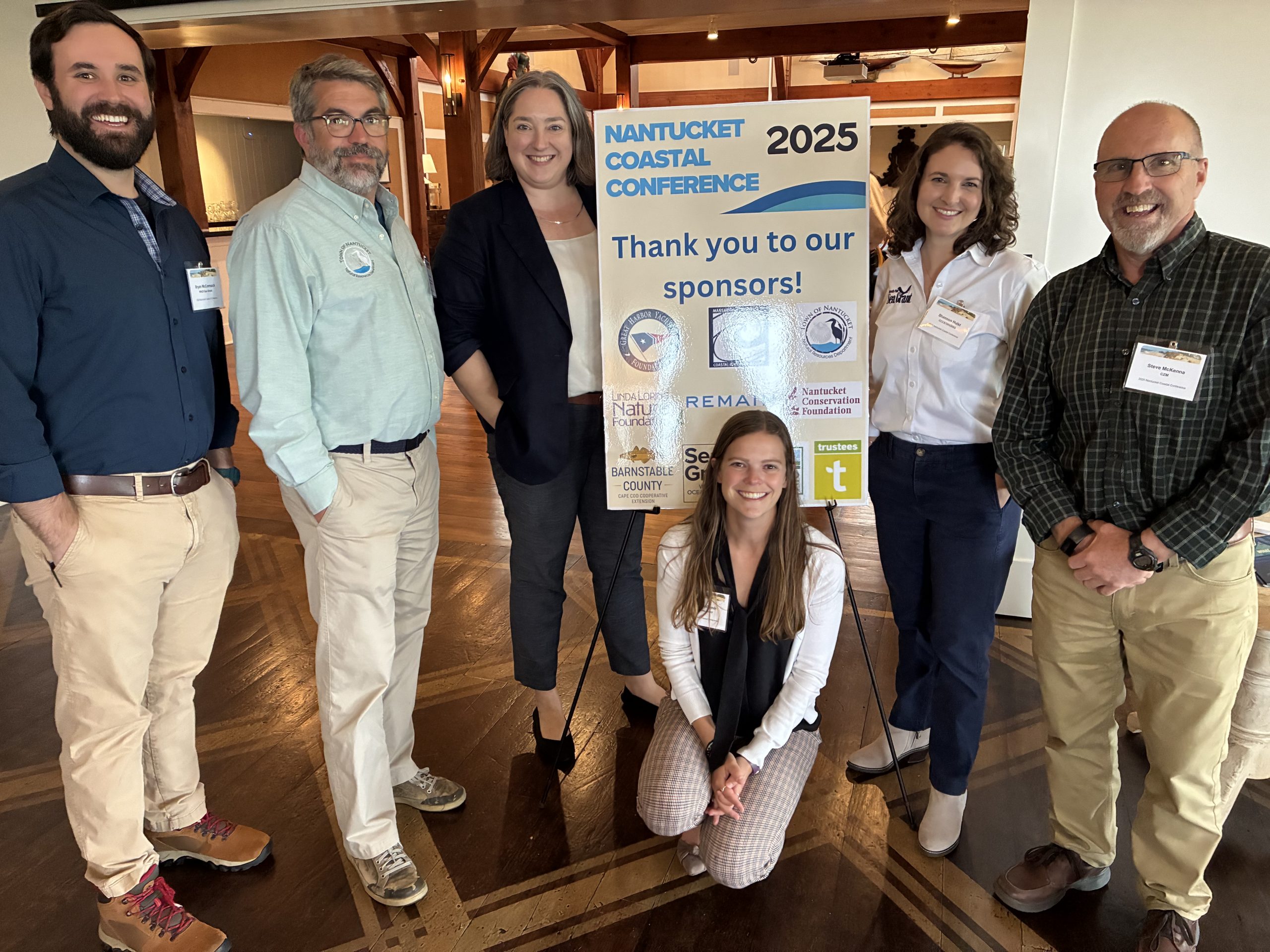 The Town of Nantucket's Jeff Carlson (second from left) and keynote speaker Alison Brazius (third from left) with WHOI Sea Grant's Bryan McCormack, Shannon Hulst, and Shelly McComb (kneeling), and Steve McKenna from MA CZM. 