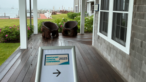 sign on the porch of the Green Harbor Yacht Clubt indicating the entrance to the Nantucket Coastal Conference