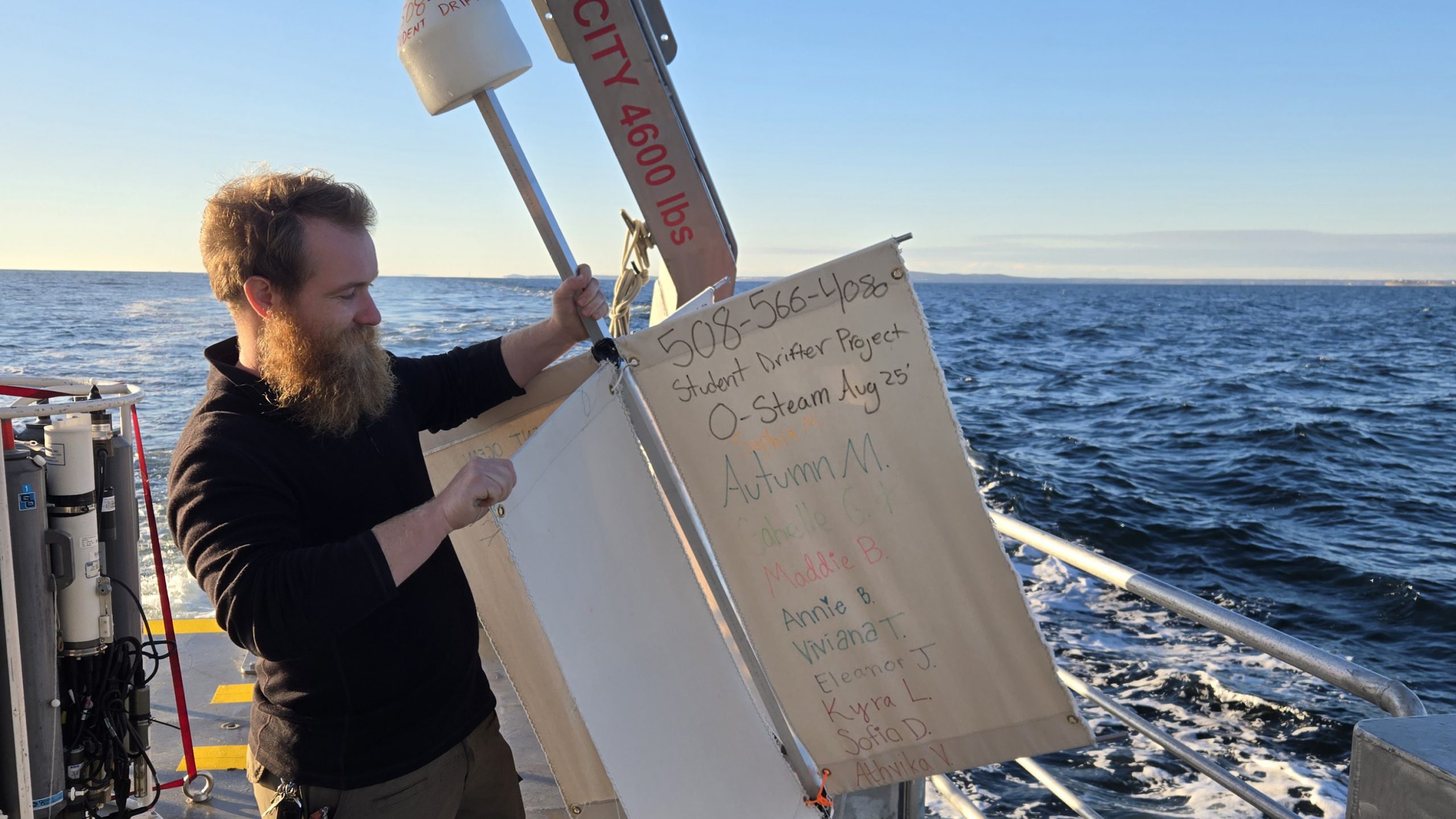 Shaun, a crew member of the RV TIOGA, gets ready to deploy a drifter into Cape Cod Bay. Photo credit: Annie Sisson.