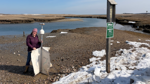 Grace Simpkins with the drifter on the snow covered beach